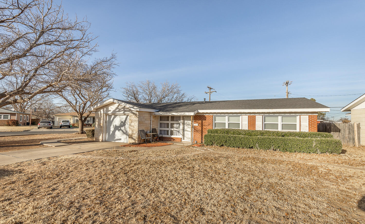 1710 43rd Street Lubbock, TX 79412 - Photo 16 of 20 a front view of a house with a yard