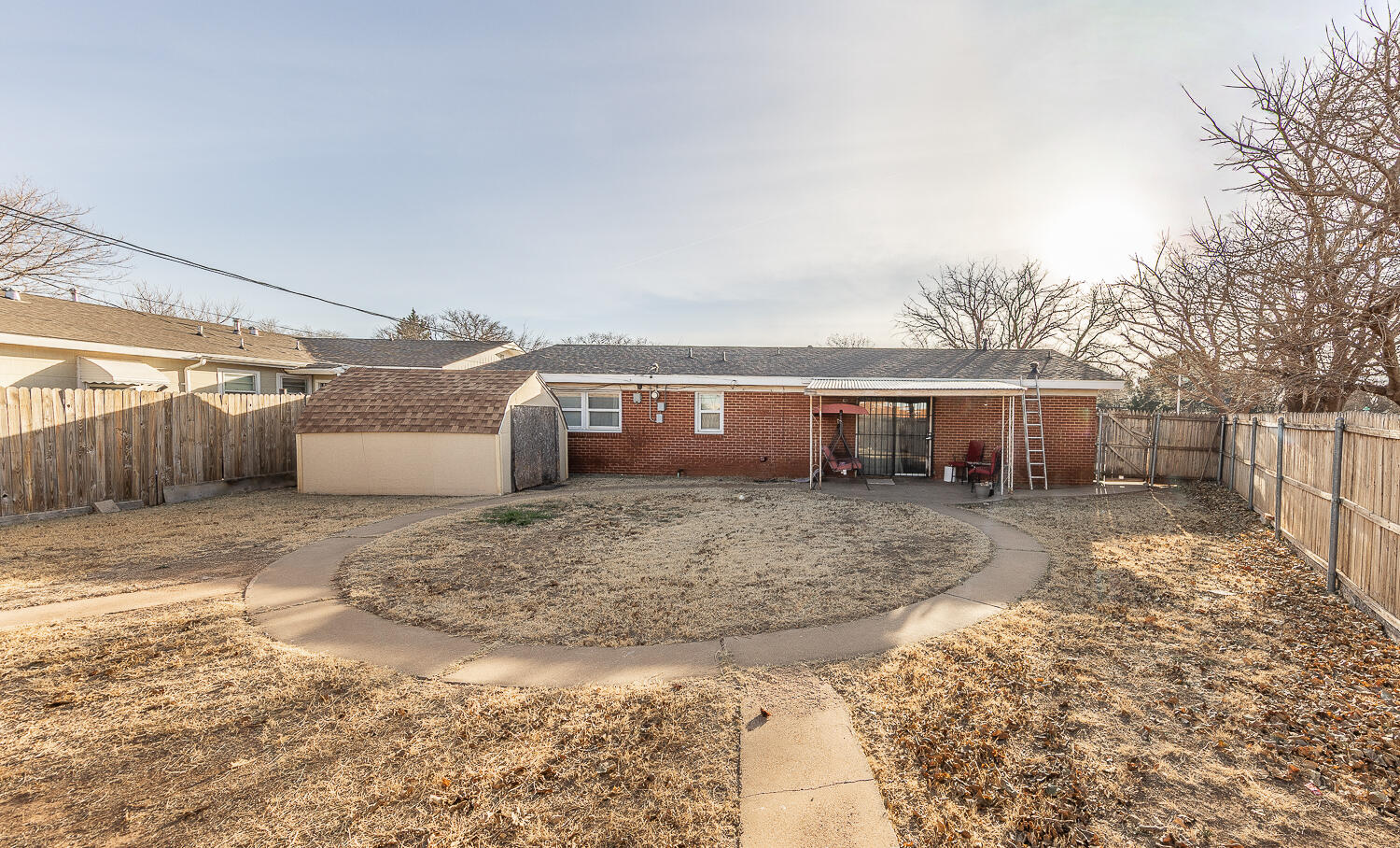 1710 43rd Street Lubbock, TX 79412 - Photo 19 of 20 a view of a house with a yard and roof