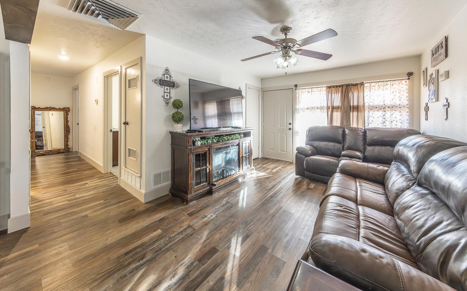 1710 43rd Street Lubbock, TX 79412 - Photo 2 of 20 a living room with furniture and a wooden floor