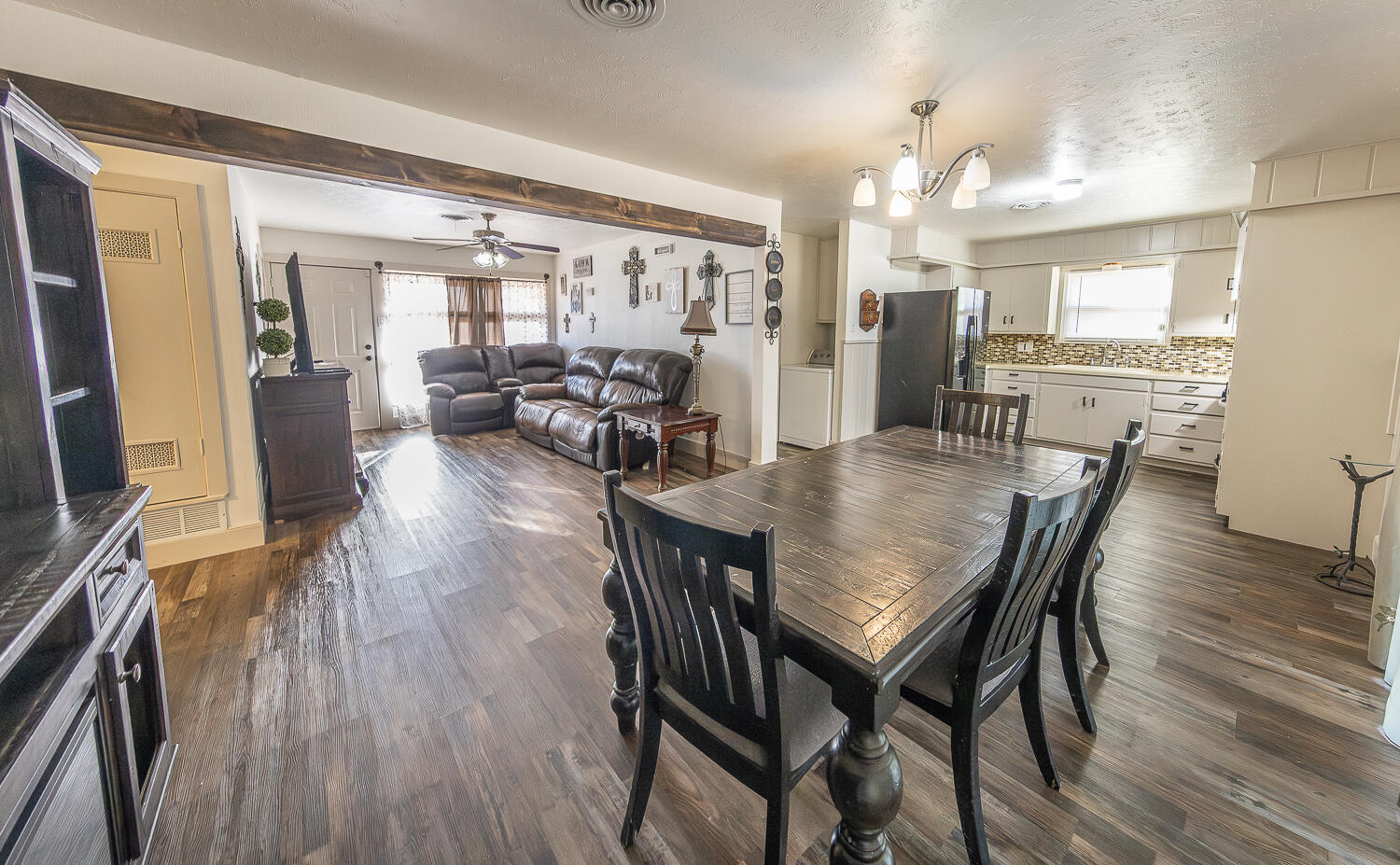 1710 43rd Street Lubbock, TX 79412 - Photo 5 of 20 a view of a dining room with furniture and wooden floor