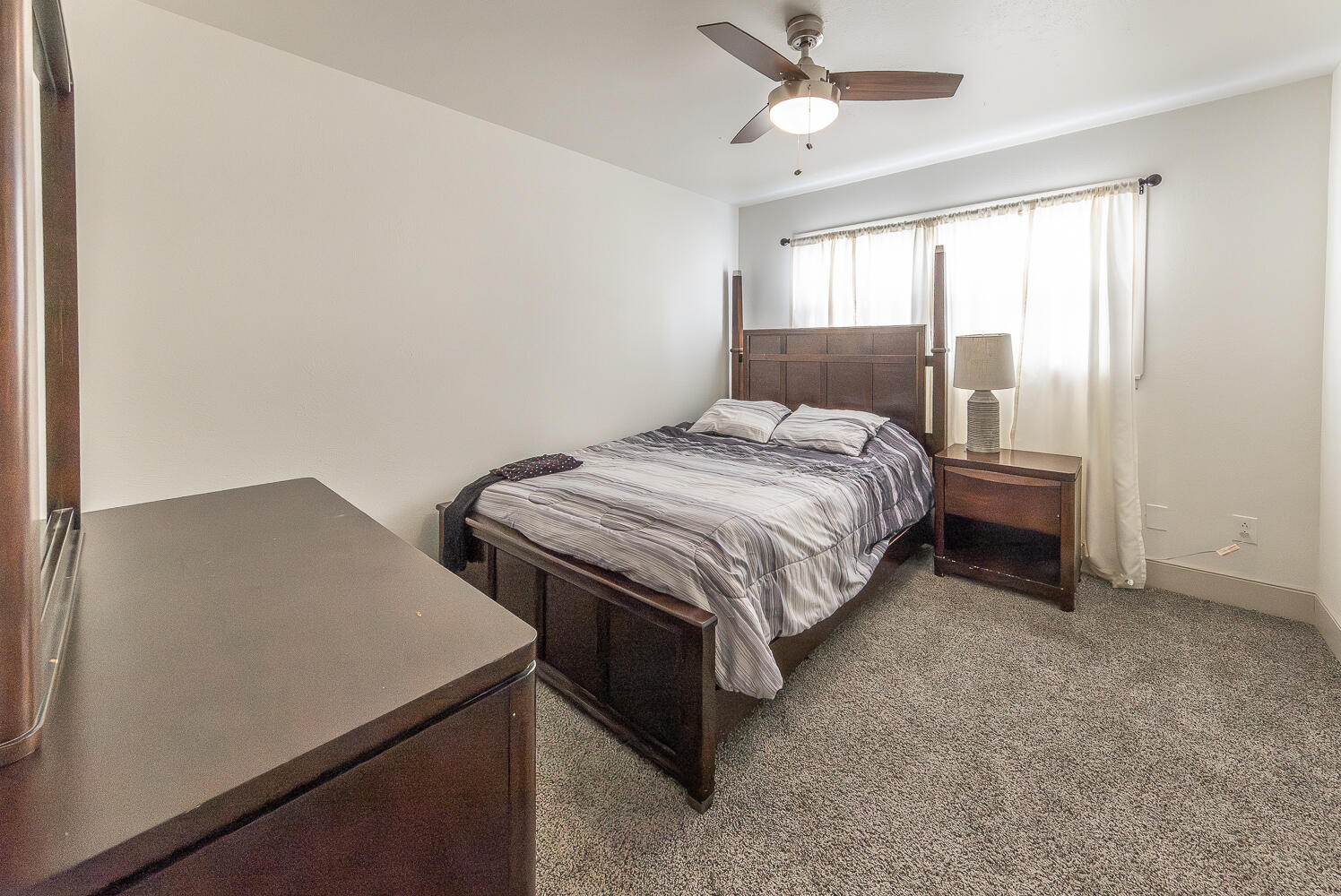 1710 43rd Street Lubbock, TX 79412 - Photo 8 of 20 a bedroom with a bed and a window