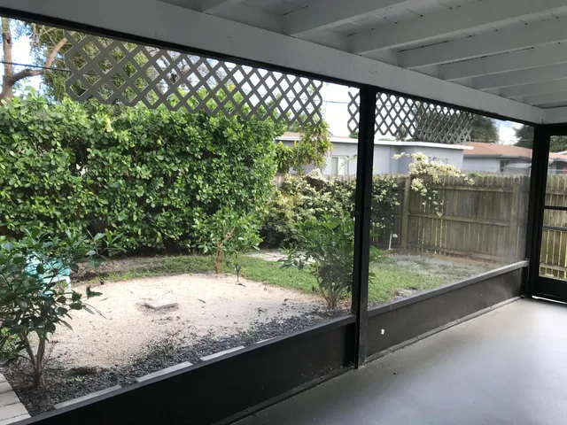 a view of an empty room with a large window