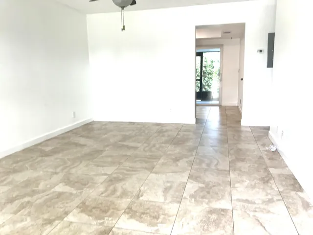 a kitchen with stainless steel appliances granite countertop a refrigerator stove and sink