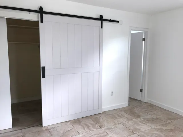 a bathroom with a toilet sink and shower