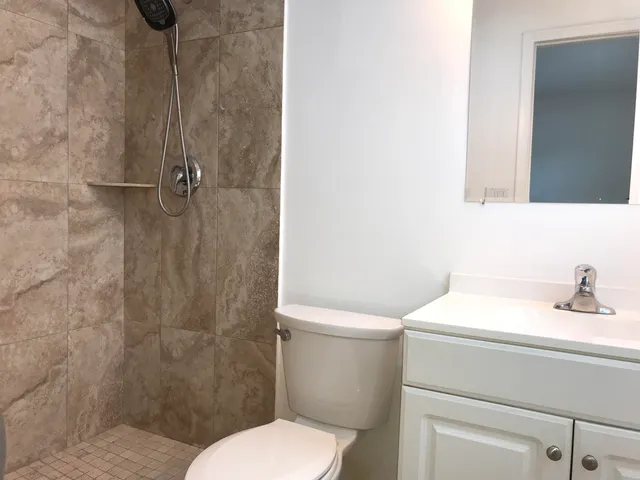 a bathroom with a toilet and a bathtub