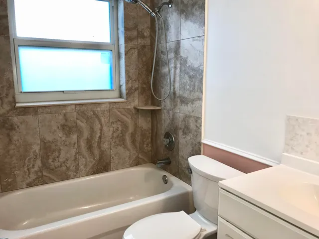 a view of a glass door with a yard from a balcony