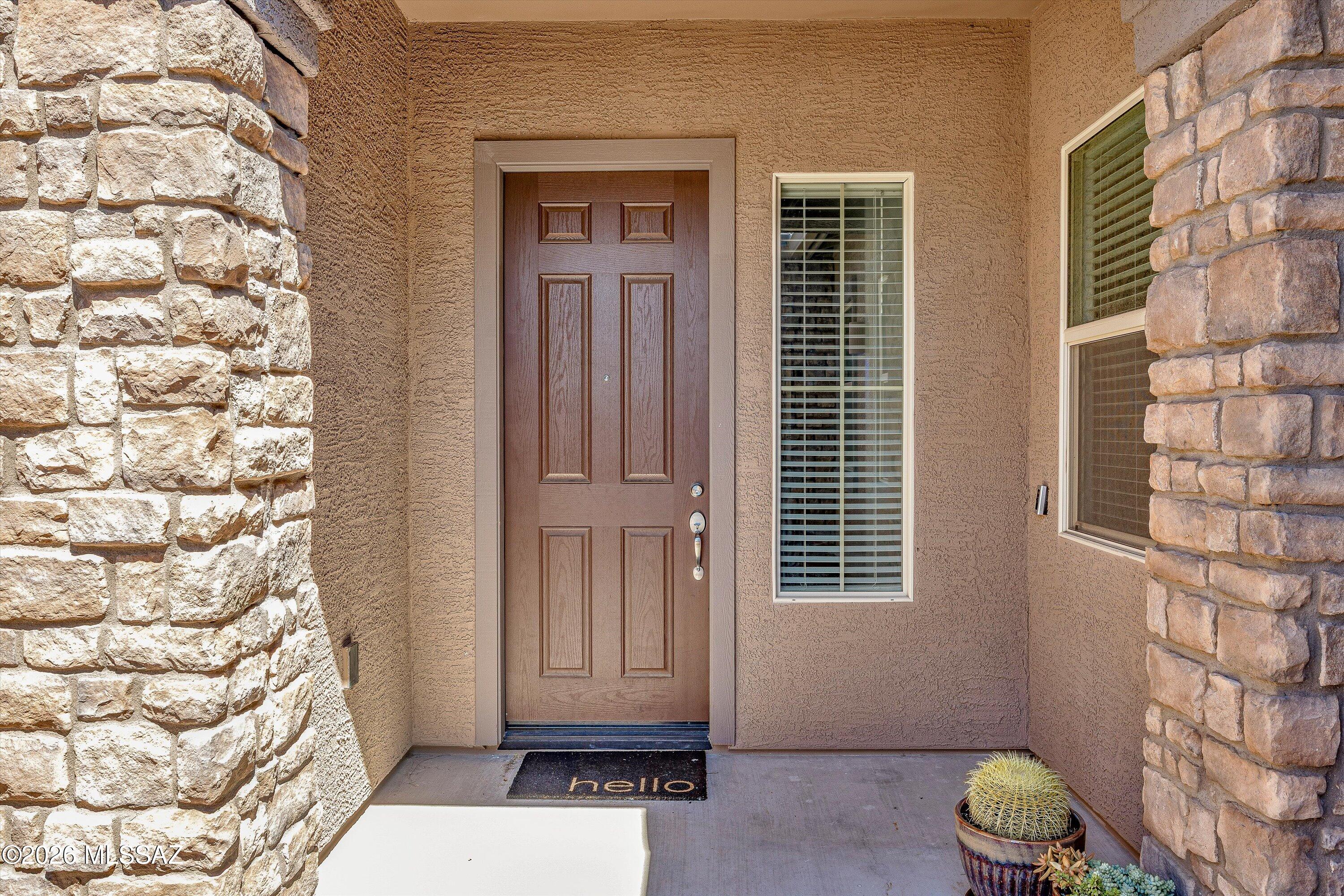 5196 West Ridgemont Court Tucson, AZ 85742 - Photo 4 of 46 Front entrance adorned with beautiful stone accents
