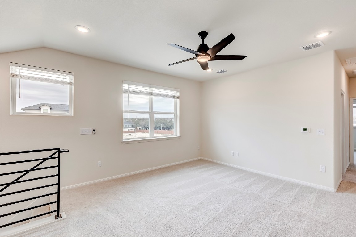 2008 Kit Circle Austin, TX 78758 - Photo 25 of 37 Unfurnished room with light colored carpet, ceiling fan, and recessed lighting