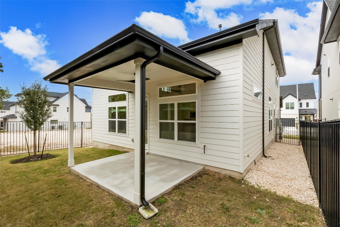 2008 Kit Circle Austin, TX 78758 - Photo 34 of 37 Back of house featuring a fenced backyard and a patio
