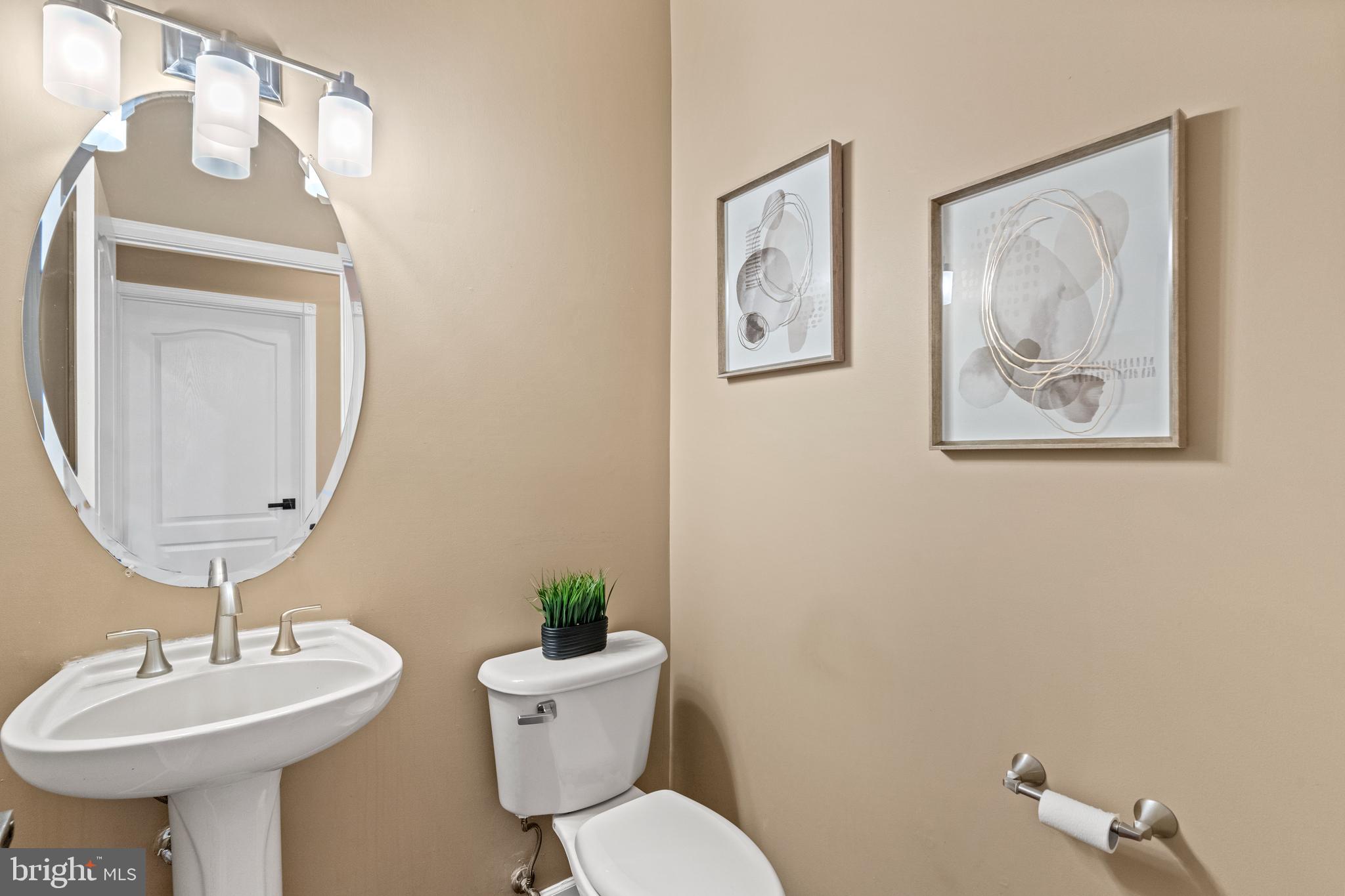 42714 Freedom Street Chantilly, VA 20152 - Photo 16 of 47 a bathroom with a toilet a sink and a mirror