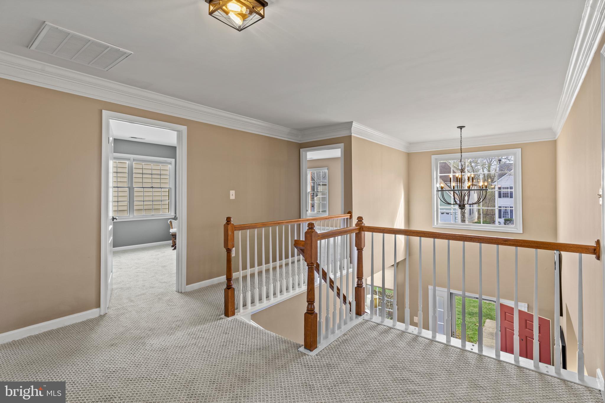 42714 Freedom Street Chantilly, VA 20152 - Photo 18 of 47 a view of a hallway with windows and stairs