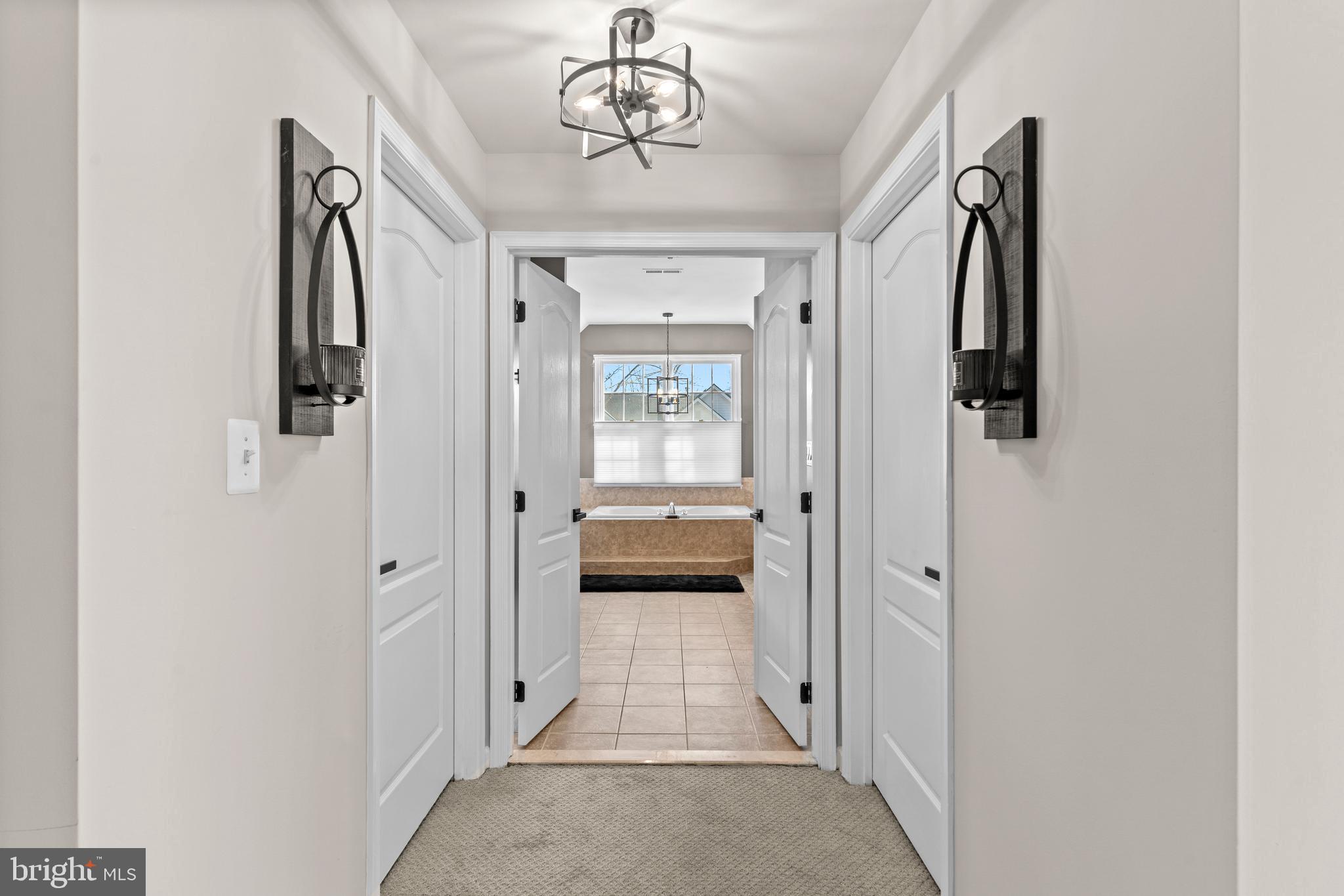 42714 Freedom Street Chantilly, VA 20152 - Photo 21 of 47 a view of a hallway with wooden shelves