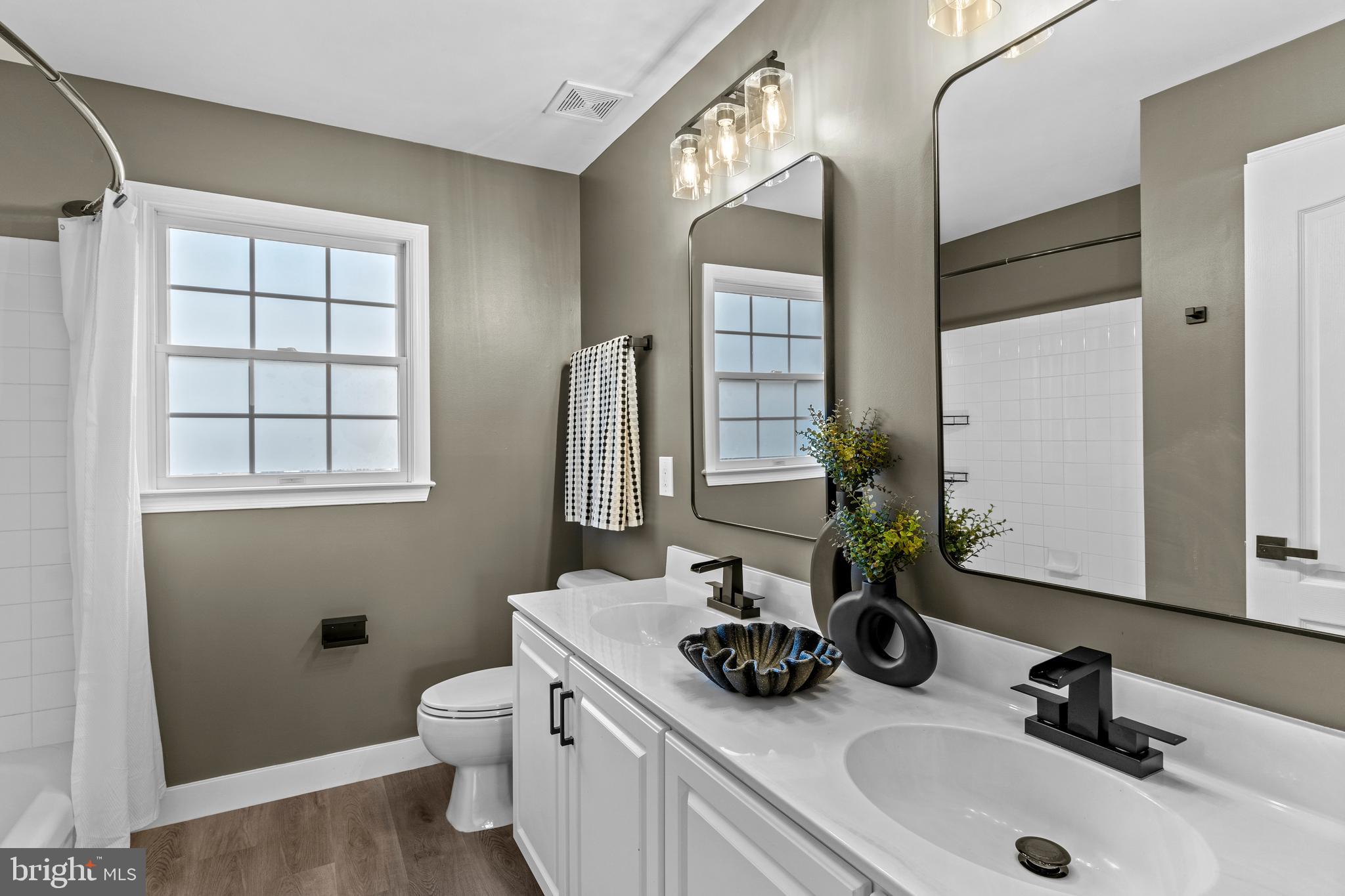 42714 Freedom Street Chantilly, VA 20152 - Photo 30 of 47 a bathroom with double sink and a mirror