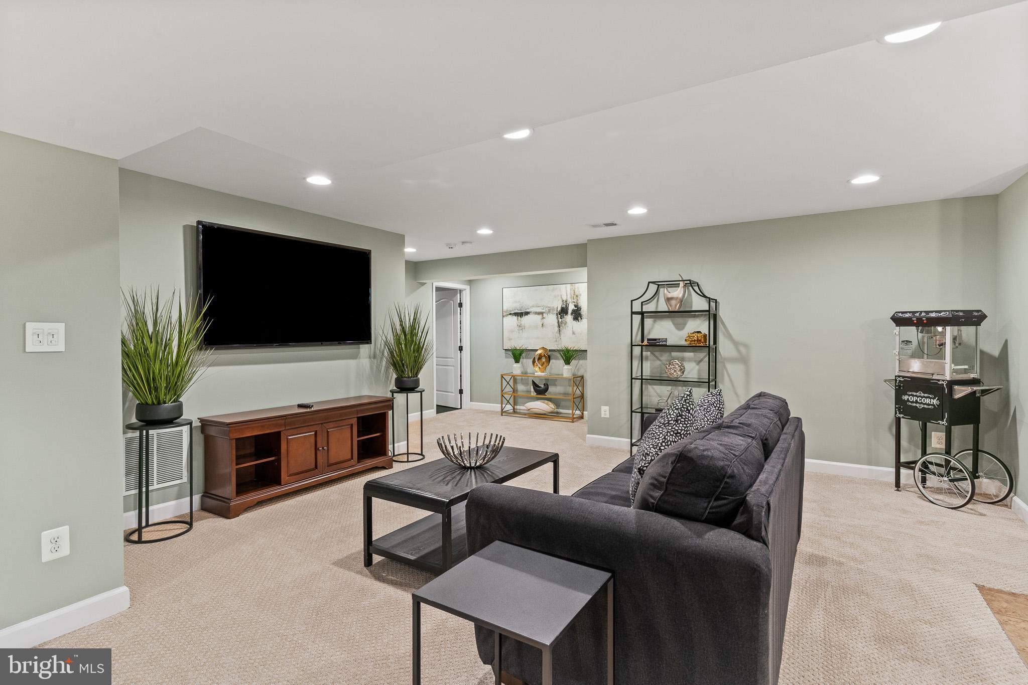42714 Freedom Street Chantilly, VA 20152 - Photo 33 of 47 a living room with furniture and a flat screen tv