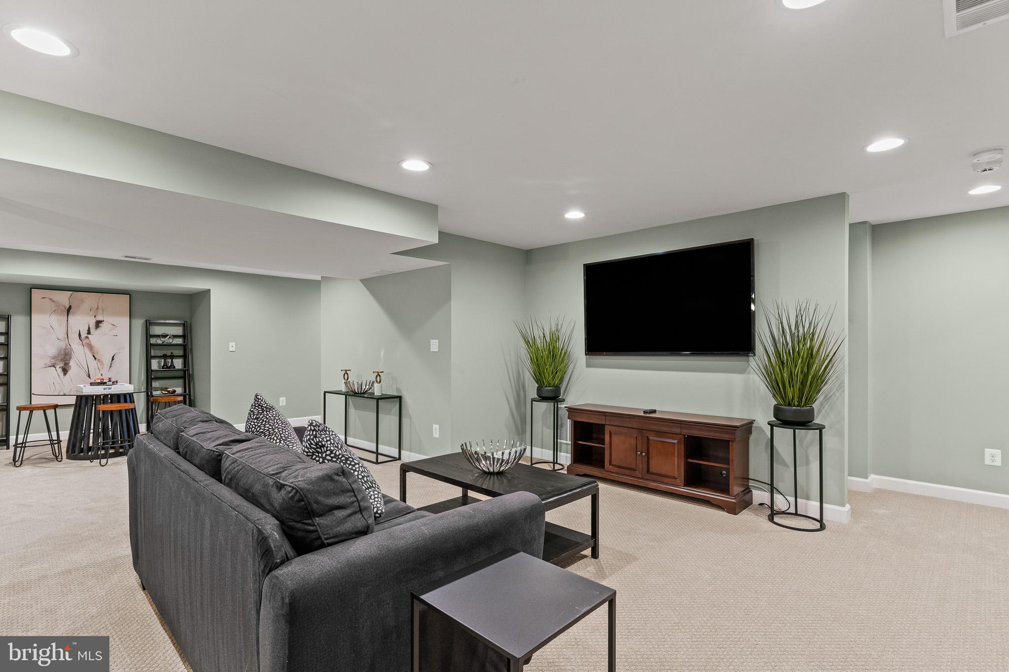 42714 Freedom Street Chantilly, VA 20152 - Photo 34 of 47 a living room with furniture and a flat screen tv