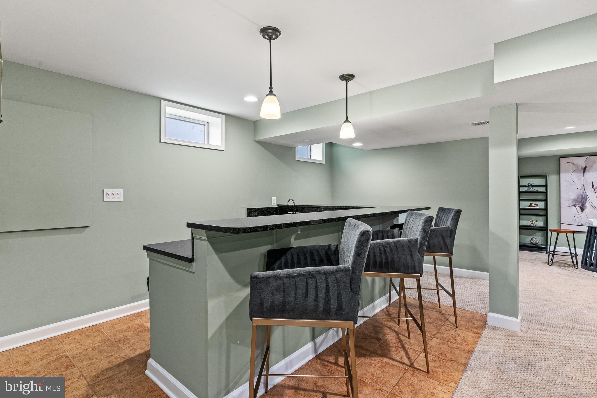 42714 Freedom Street Chantilly, VA 20152 - Photo 35 of 47 a view of a dining room with furniture and wooden floor