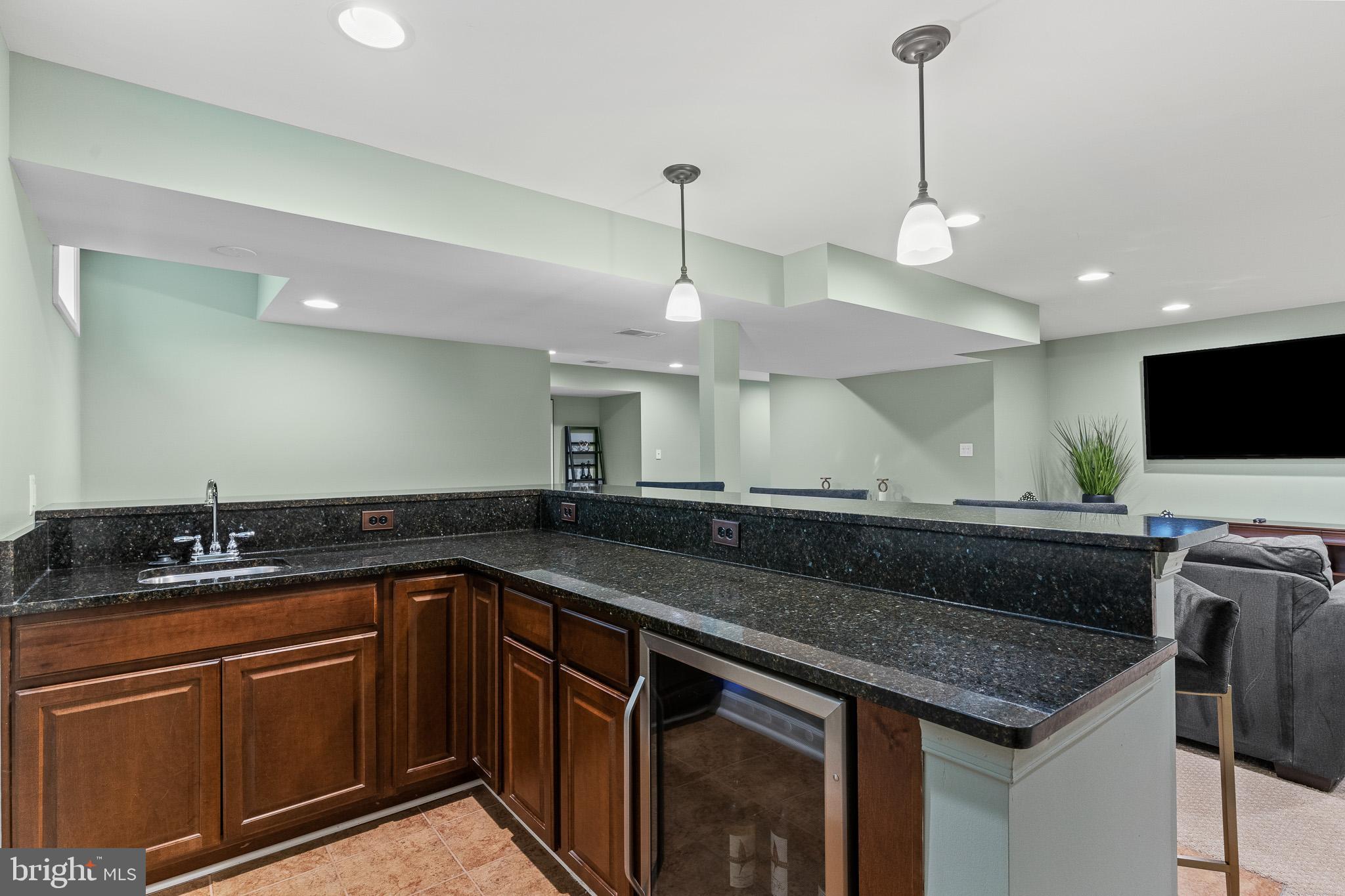 42714 Freedom Street Chantilly, VA 20152 - Photo 36 of 47 a kitchen with a sink and a stove