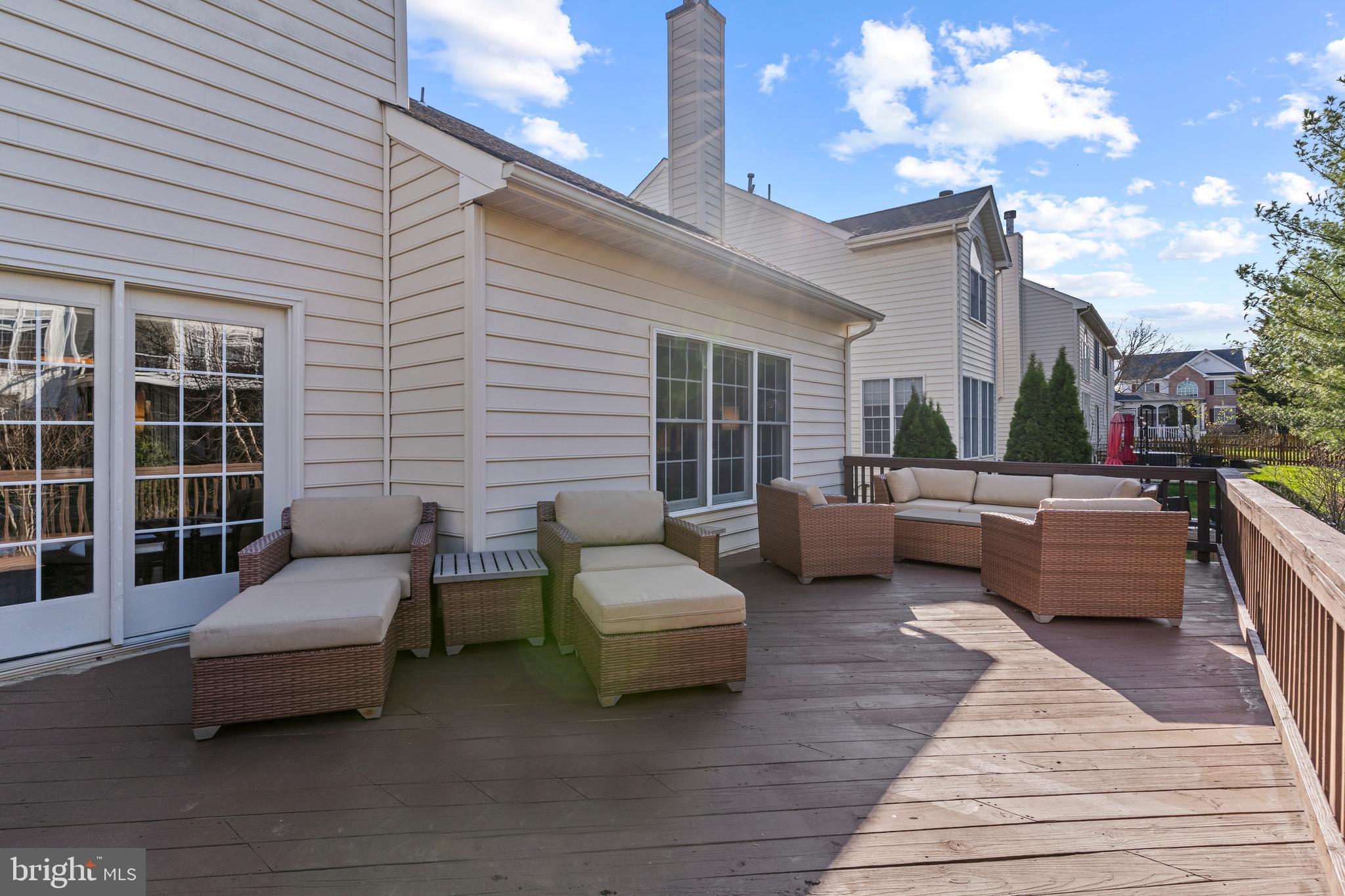 42714 Freedom Street Chantilly, VA 20152 - Photo 45 of 47 a view of a patio with couches and a potted plant