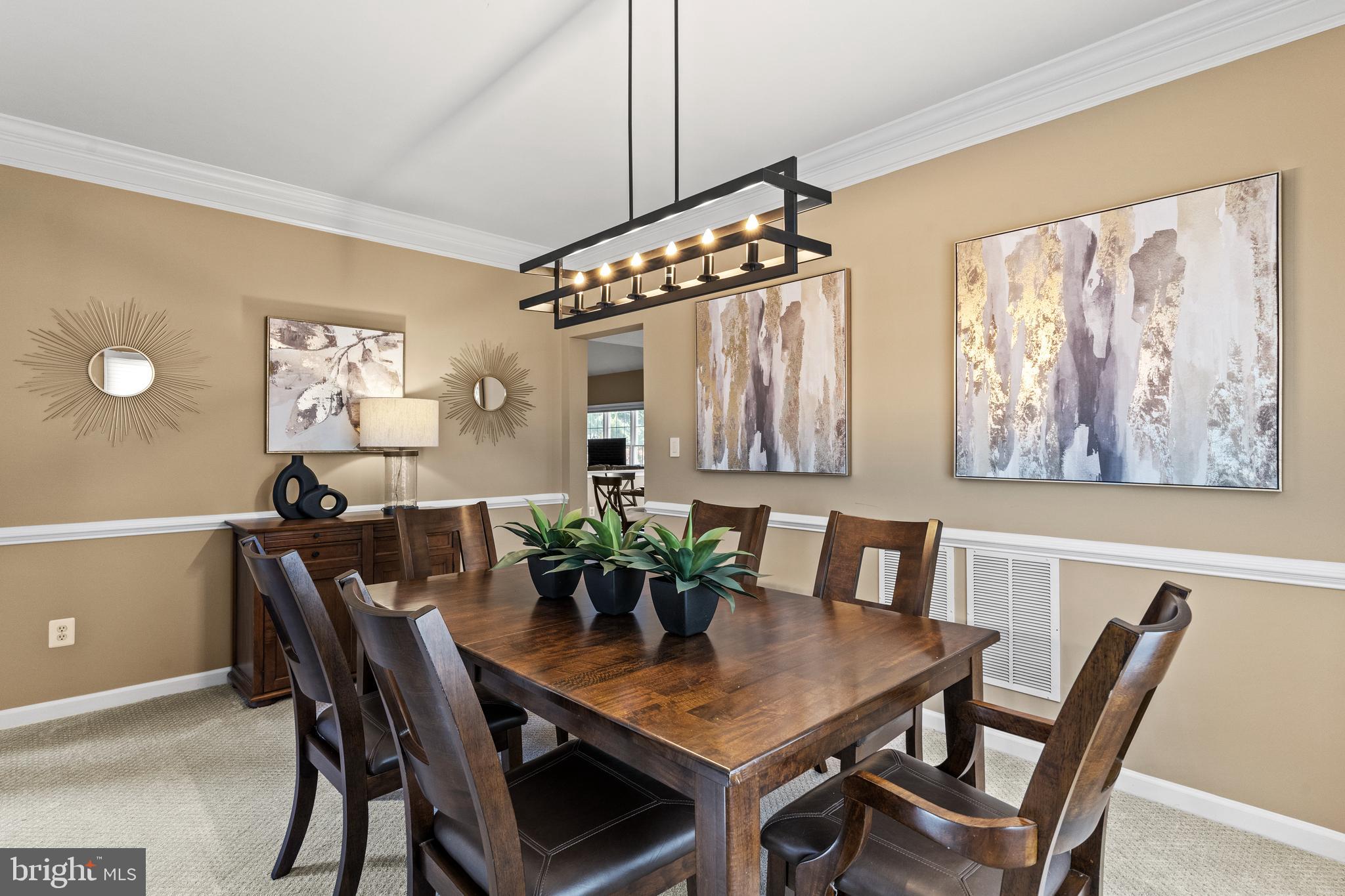 42714 Freedom Street Chantilly, VA 20152 - Photo 6 of 47 a view of a dining room with furniture and wooden floor