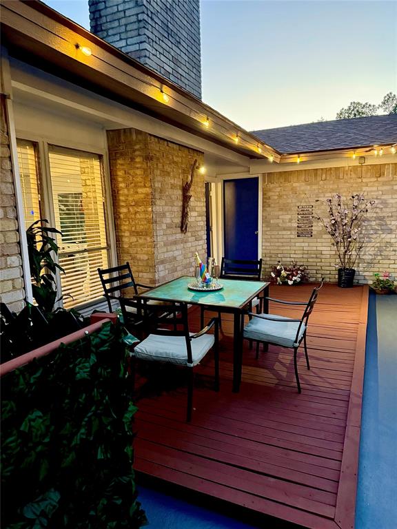 37 Merrie Circle Richardson, TX 75081 - Photo 24 of 28 Wooden terrace featuring outdoor dining area