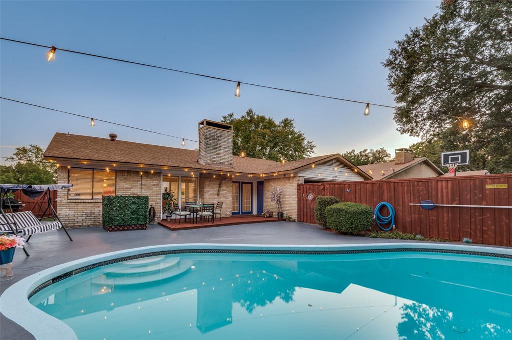 37 Merrie Circle Richardson, TX 75081 - Photo 25 of 28 View of swimming pool featuring a wooden deck and a patio