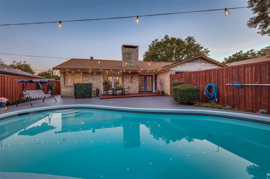 37 Merrie Circle Richardson, TX 75081 - Photo 27 of 28 Pool at dusk featuring a fenced backyard and a patio
