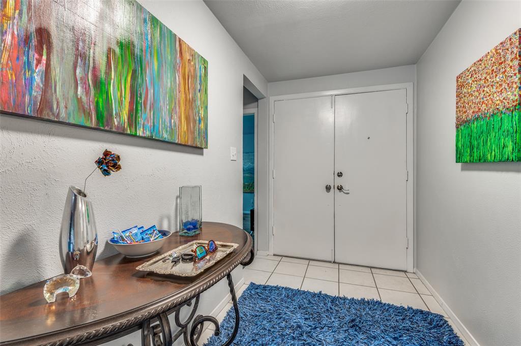 37 Merrie Circle Richardson, TX 75081 - Photo 4 of 28 Entrance foyer with light tile patterned flooring and baseboards