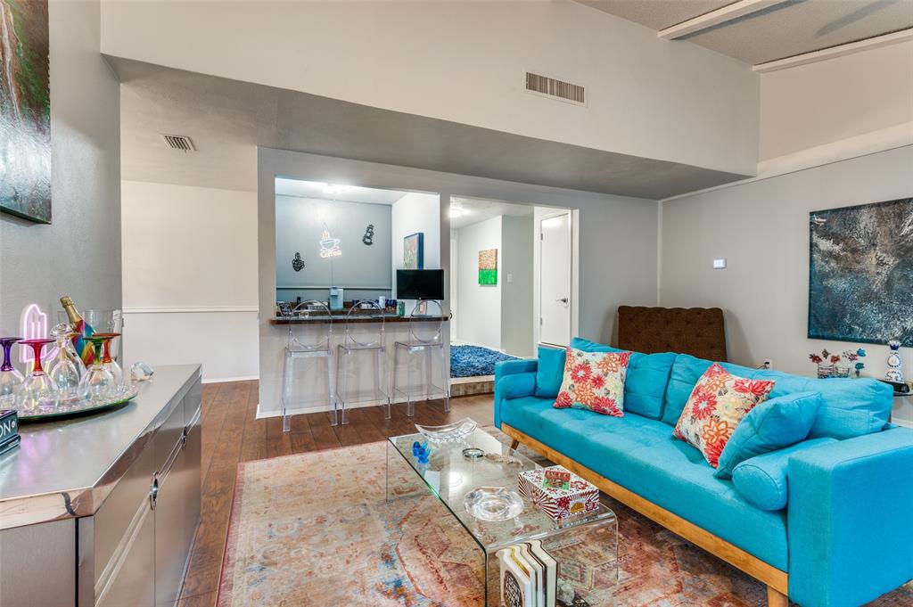 37 Merrie Circle Richardson, TX 75081 - Photo 7 of 28 Living room with dark wood-style flooring and baseboards