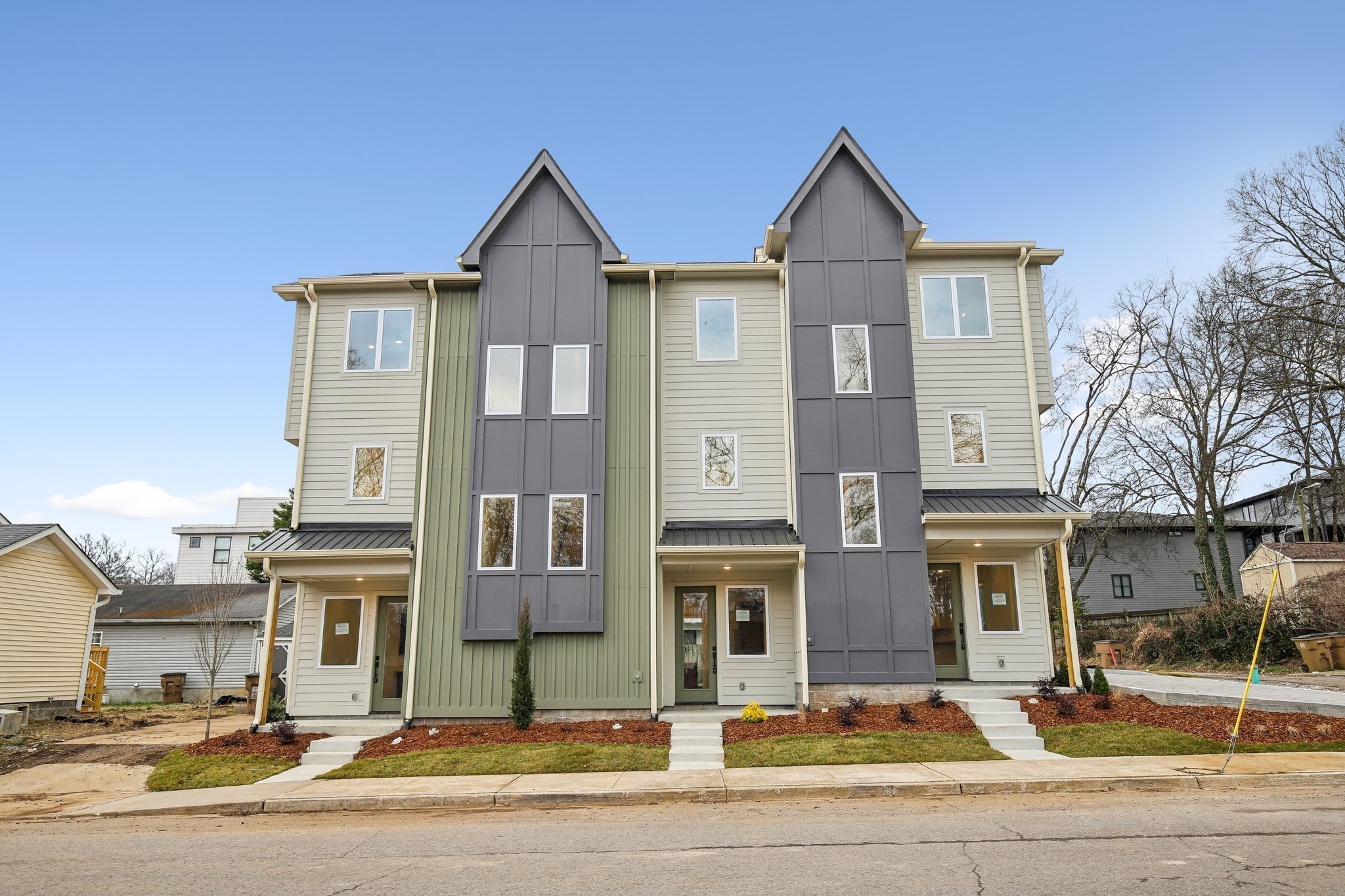 914 Smiley Street Nashville, TN 37206 - Photo 2 of 32 a front view of a residential apartment building with a yard