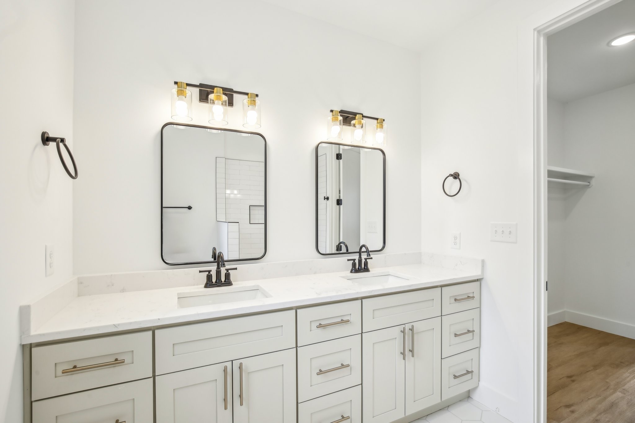 914 Smiley Street Nashville, TN 37206 - Photo 22 of 32 a bathroom with double vanity sinks and a mirror