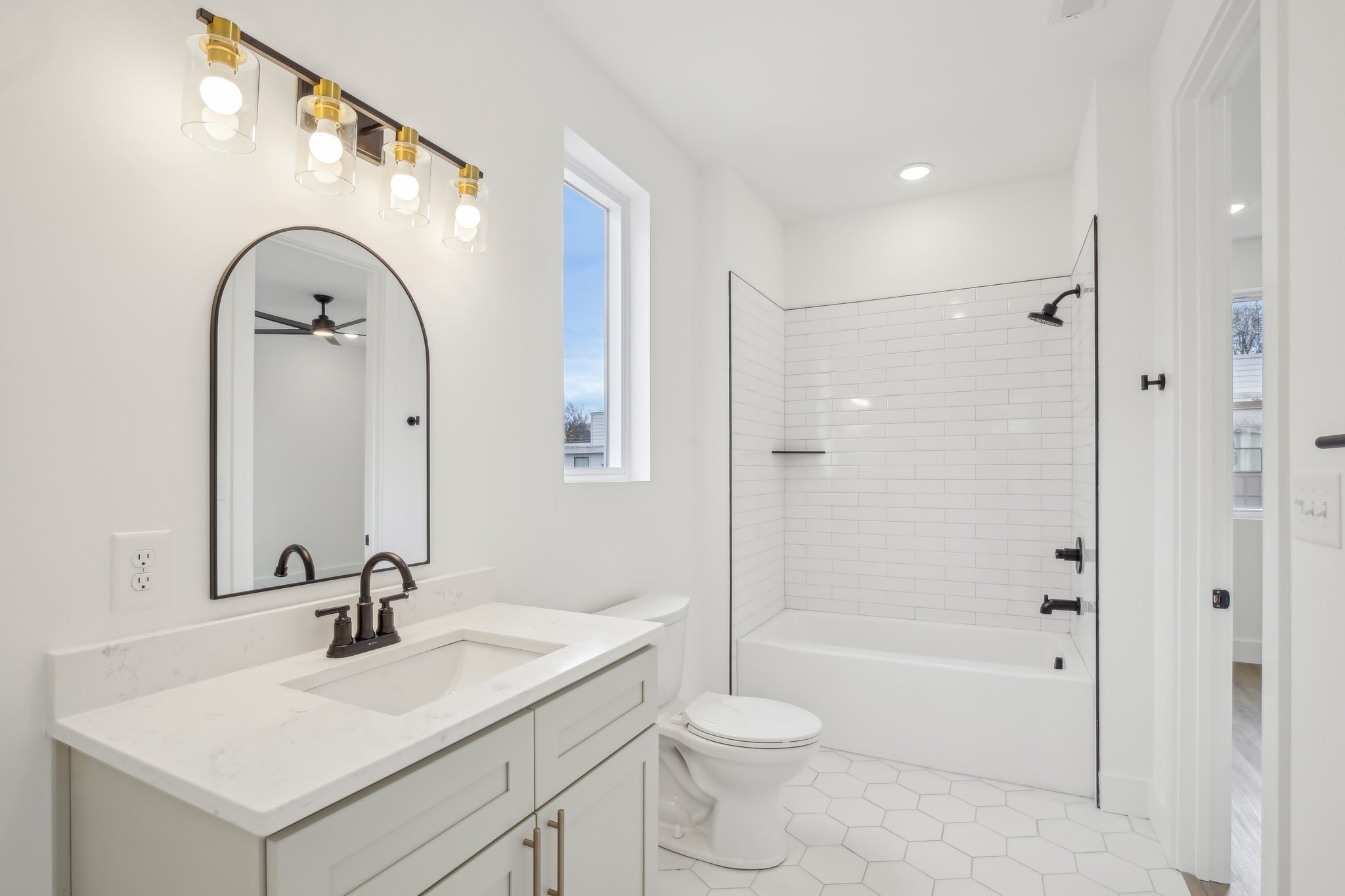 914 Smiley Street Nashville, TN 37206 - Photo 28 of 32 a bathroom with a sink a toilet and a mirror
