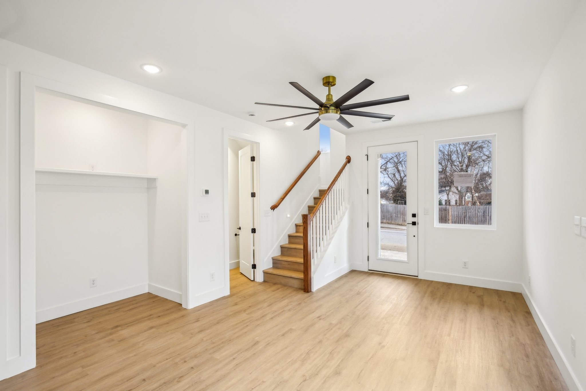 914 Smiley Street Nashville, TN 37206 - Photo 4 of 32 a view of a hallway with wooden floor and staircase