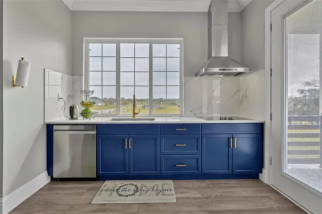 a kitchen with a sink and a large window