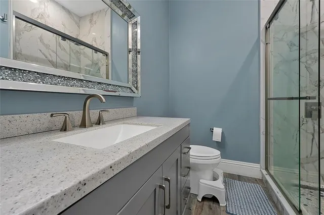 a kitchen with stainless steel appliances granite countertop a sink and cabinets