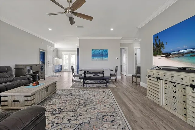 a view of a dining room with furniture and wooden floor