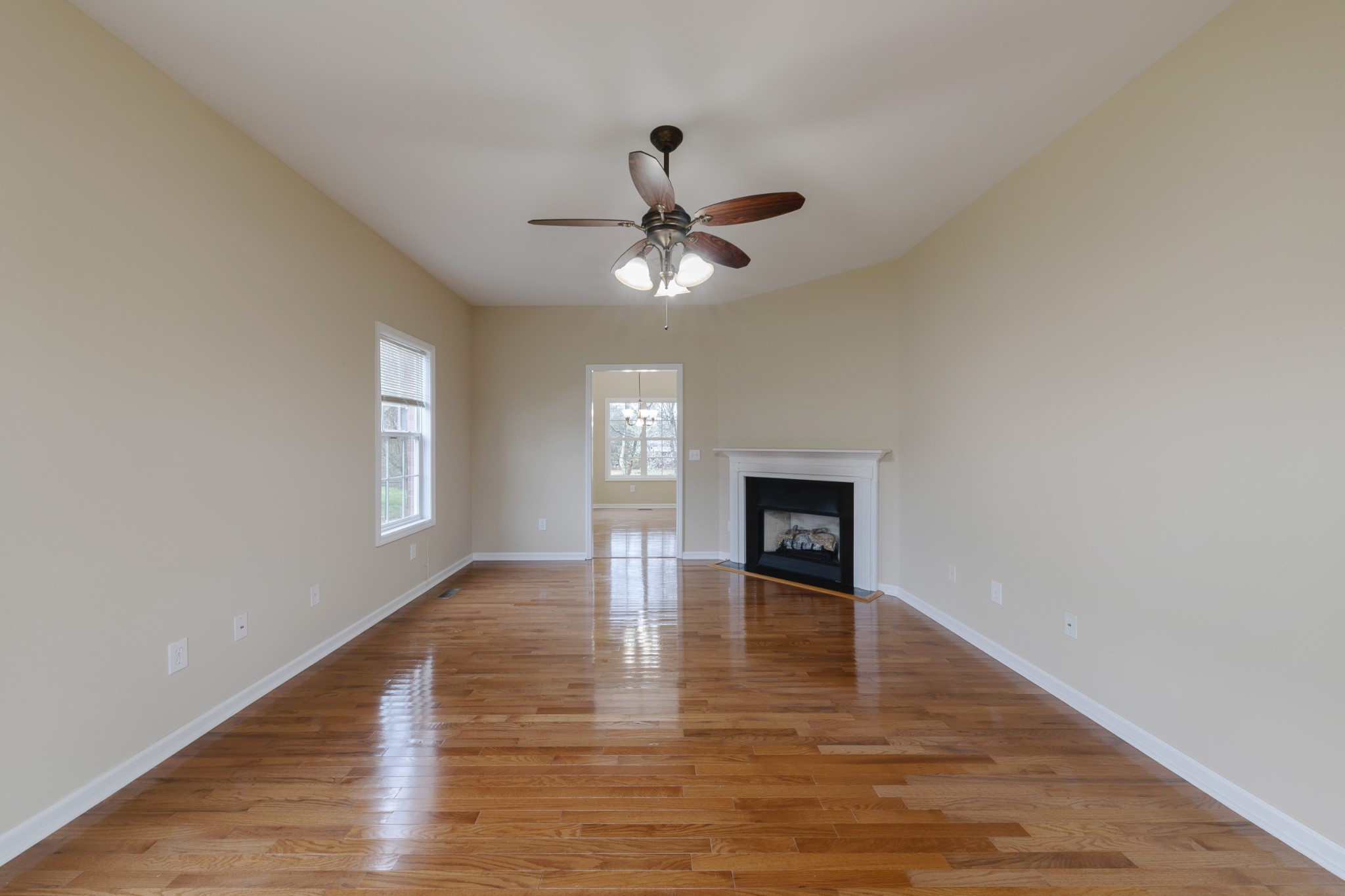 415 Duck River Road Manchester, TN 37355 - Photo 7 of 34 a view of an empty room with a window and a kitchen