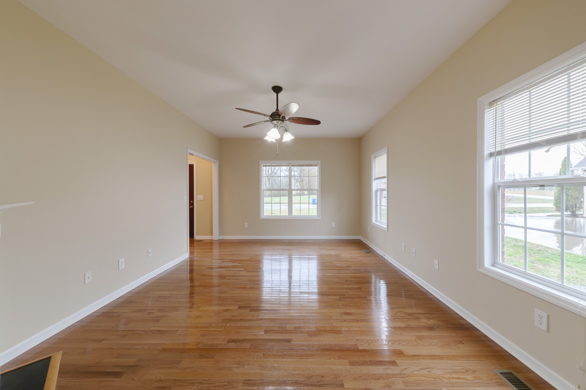 415 Duck River Road Manchester, TN 37355 - Photo 8 of 34 a view of an empty room with wooden floor and a window