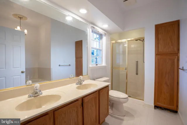 a bath room with a bath tub and a shower