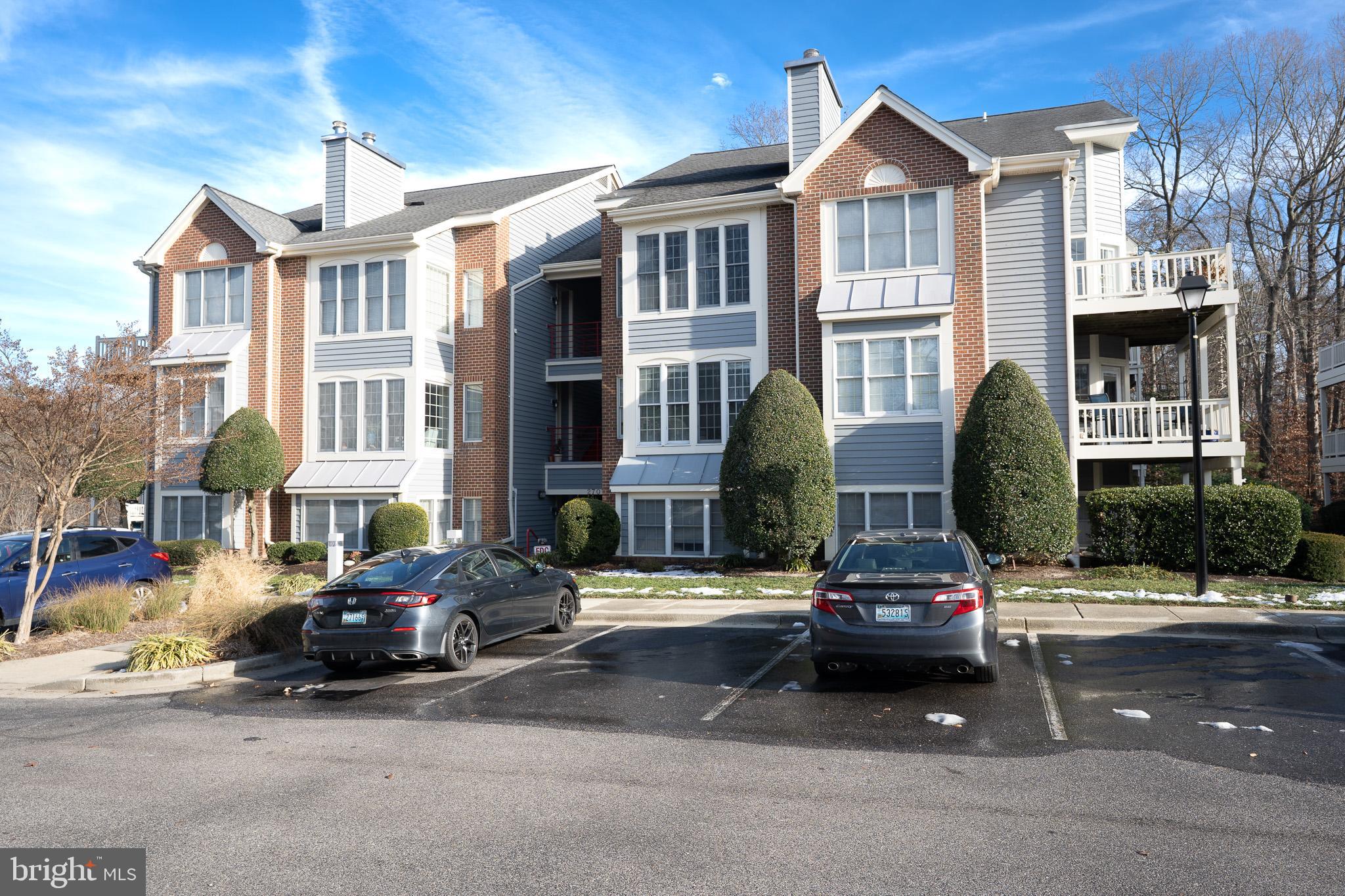 2707 Summerview Way, Unit 101 Annapolis, MD 21401 - Photo 22 of 24 a car parked in front of a building