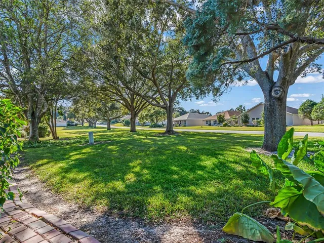 a house view with a sitting space and garden
