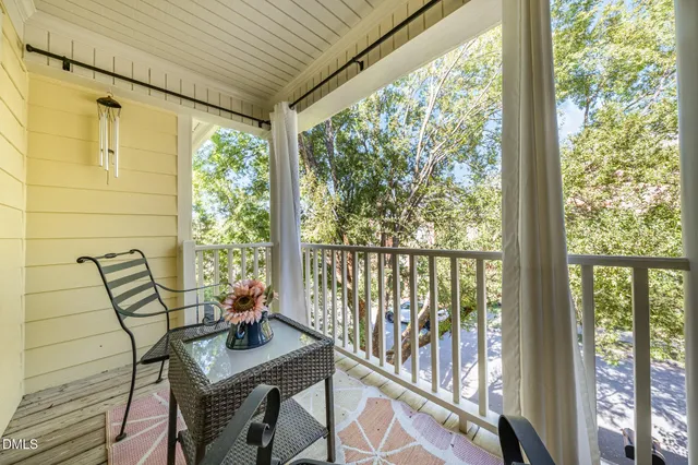 a view of a room with a furniture and balcony
