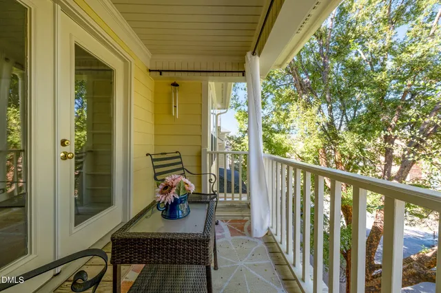 a view of a balcony with chairs