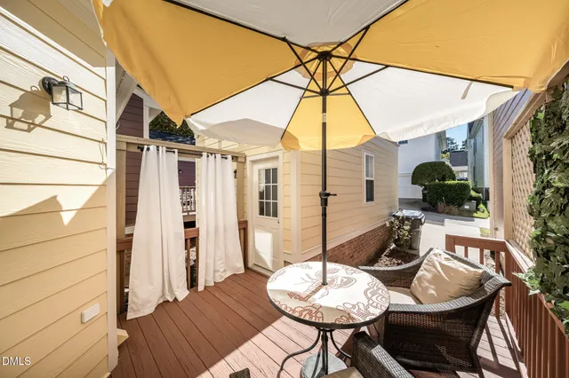 a outdoor space with furniture and umbrella