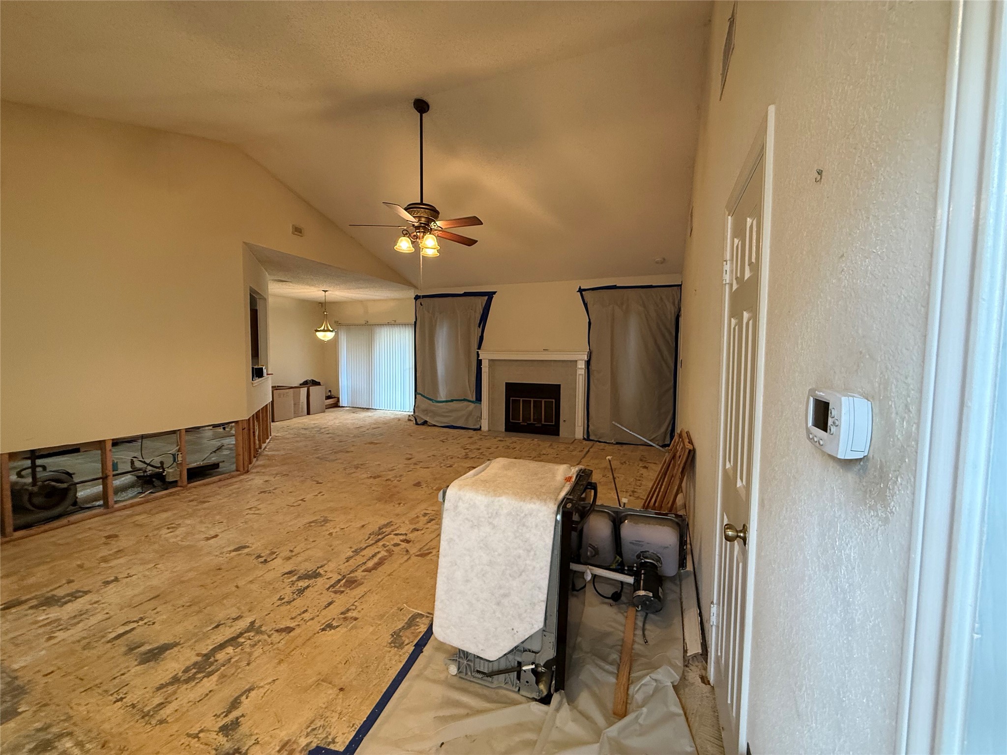 11816 Bittern Hollow Austin, TX 78758 - Photo 9 of 30 Spacious interior with vaulted ceilings, featuring an exposed subfloor ready for new finishes