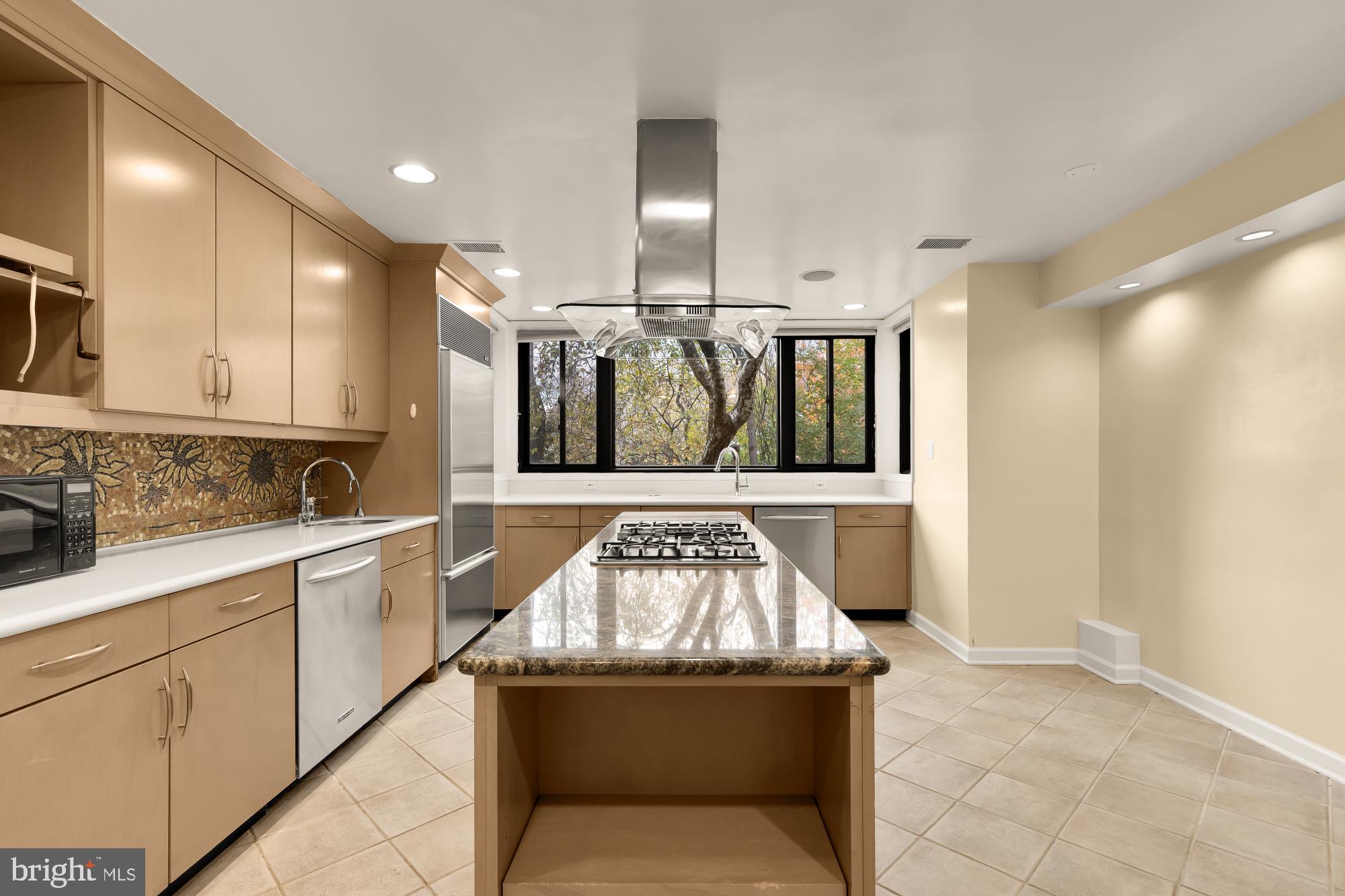 1434 Kirby Road McLean, VA 22101 - Photo 21 of 53 a kitchen with stainless steel appliances granite countertop a sink and cabinets