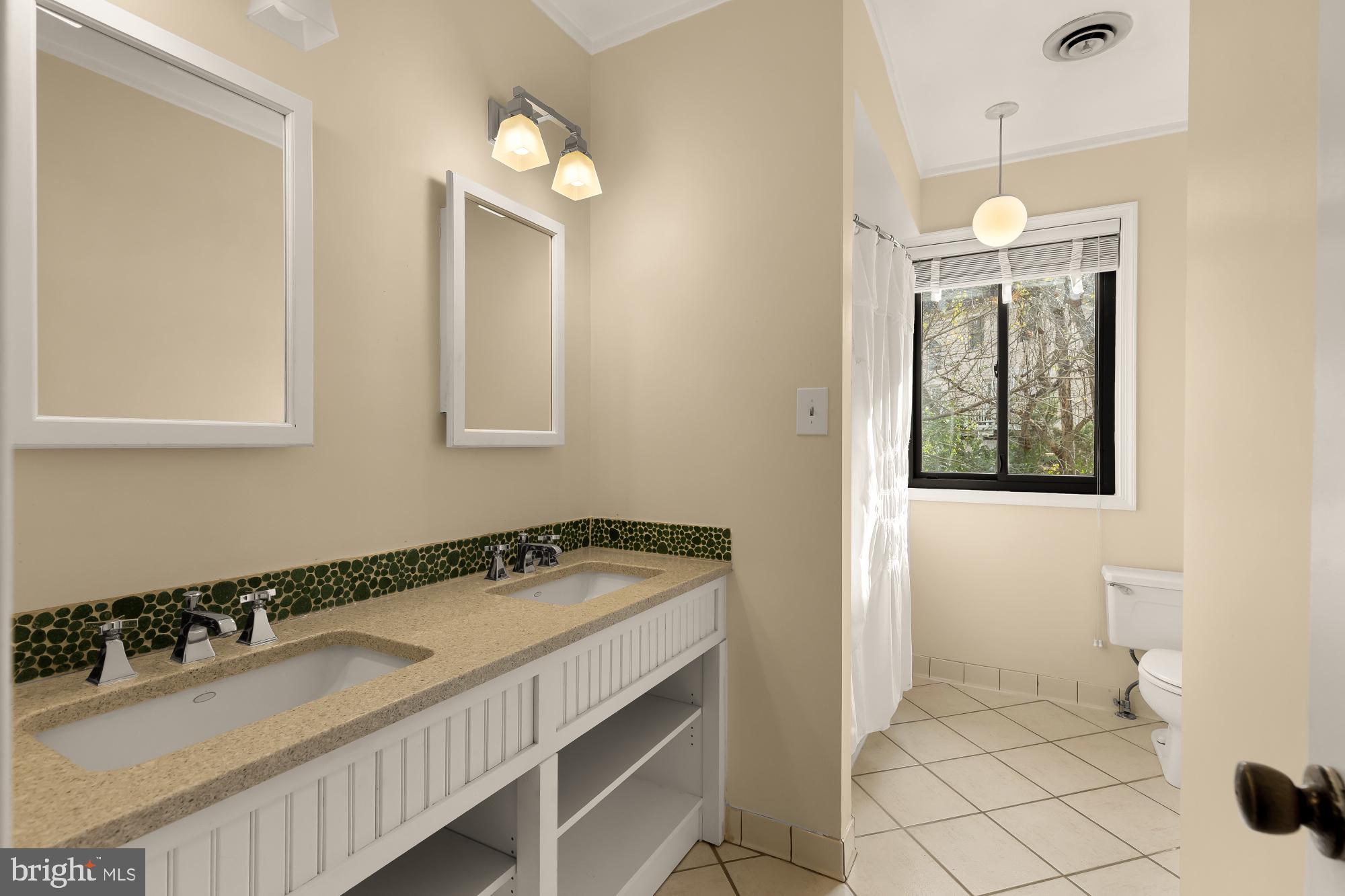 1434 Kirby Road McLean, VA 22101 - Photo 35 of 53 a bathroom with a sink and a mirror