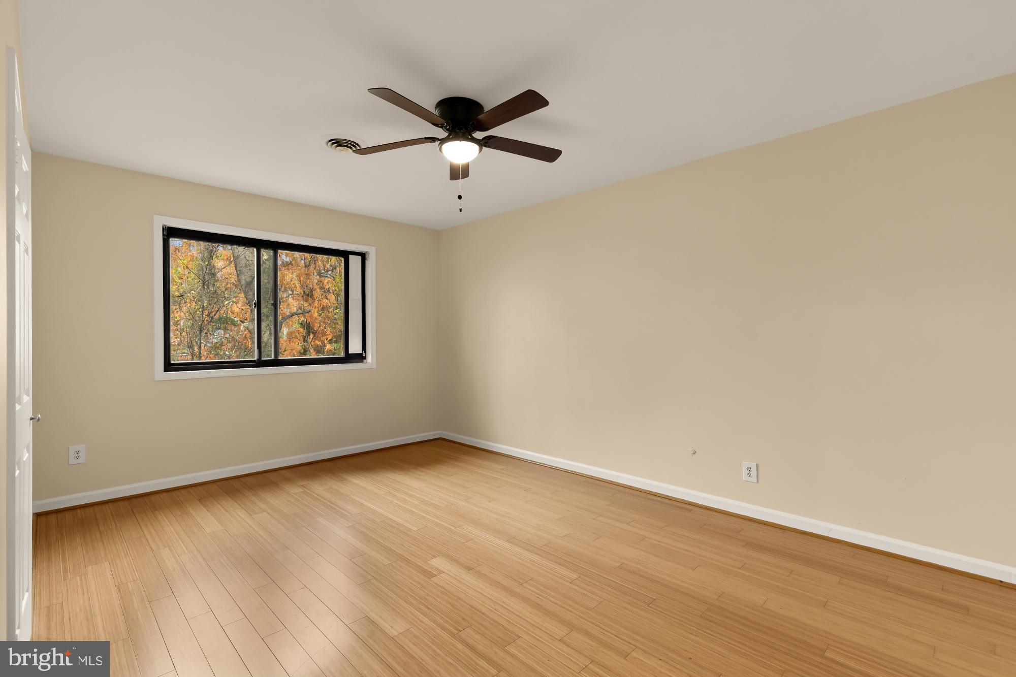 1434 Kirby Road McLean, VA 22101 - Photo 37 of 53 a view of an empty room with wooden floor and a window