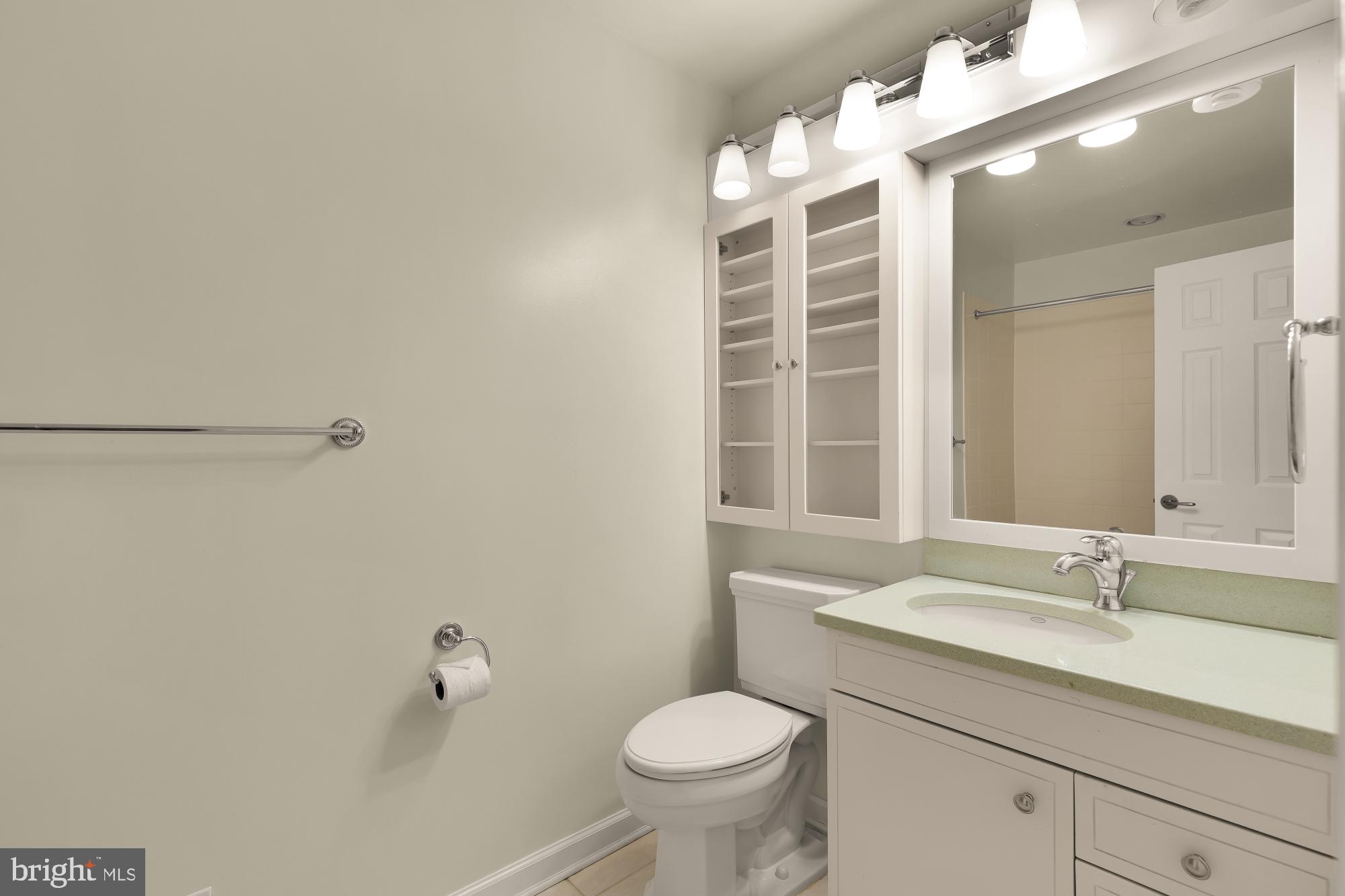 1434 Kirby Road McLean, VA 22101 - Photo 44 of 53 a bathroom with a granite countertop sink mirror vanity and toilet