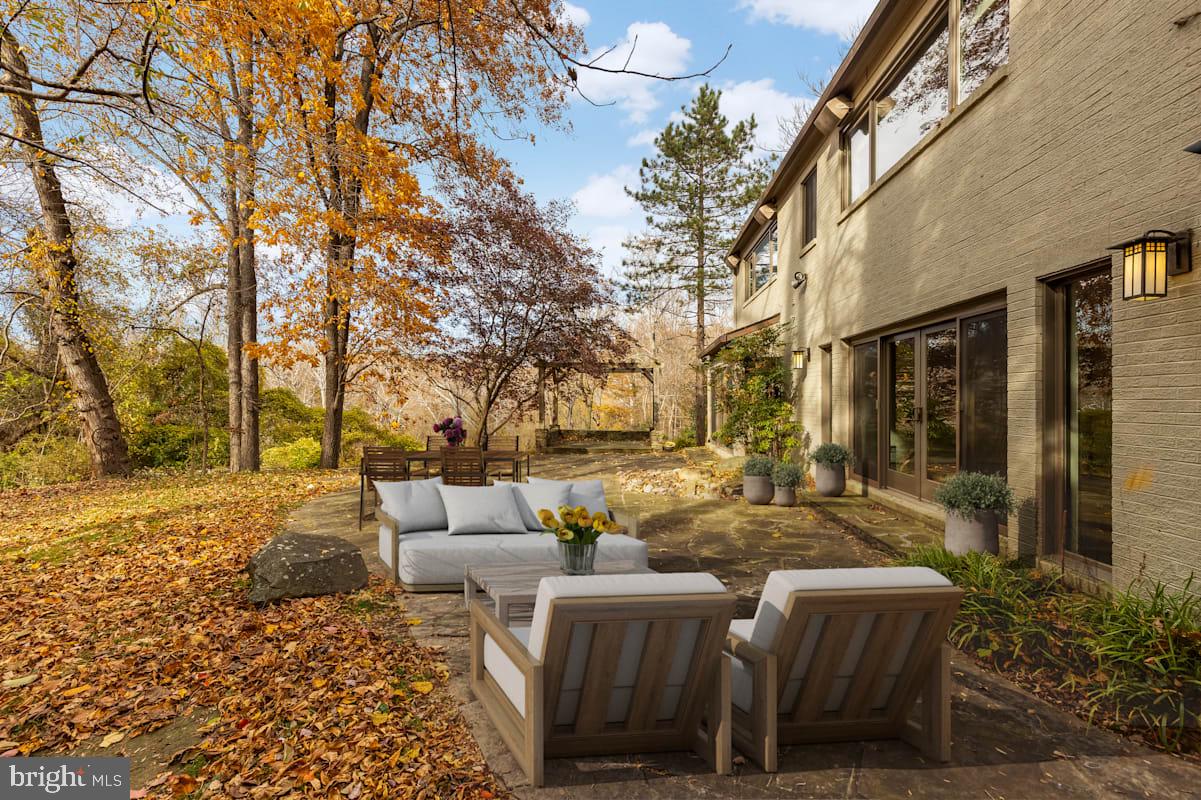 1434 Kirby Road McLean, VA 22101 - Photo 45 of 53 a view of a patio with couches table and chairs and potted plants