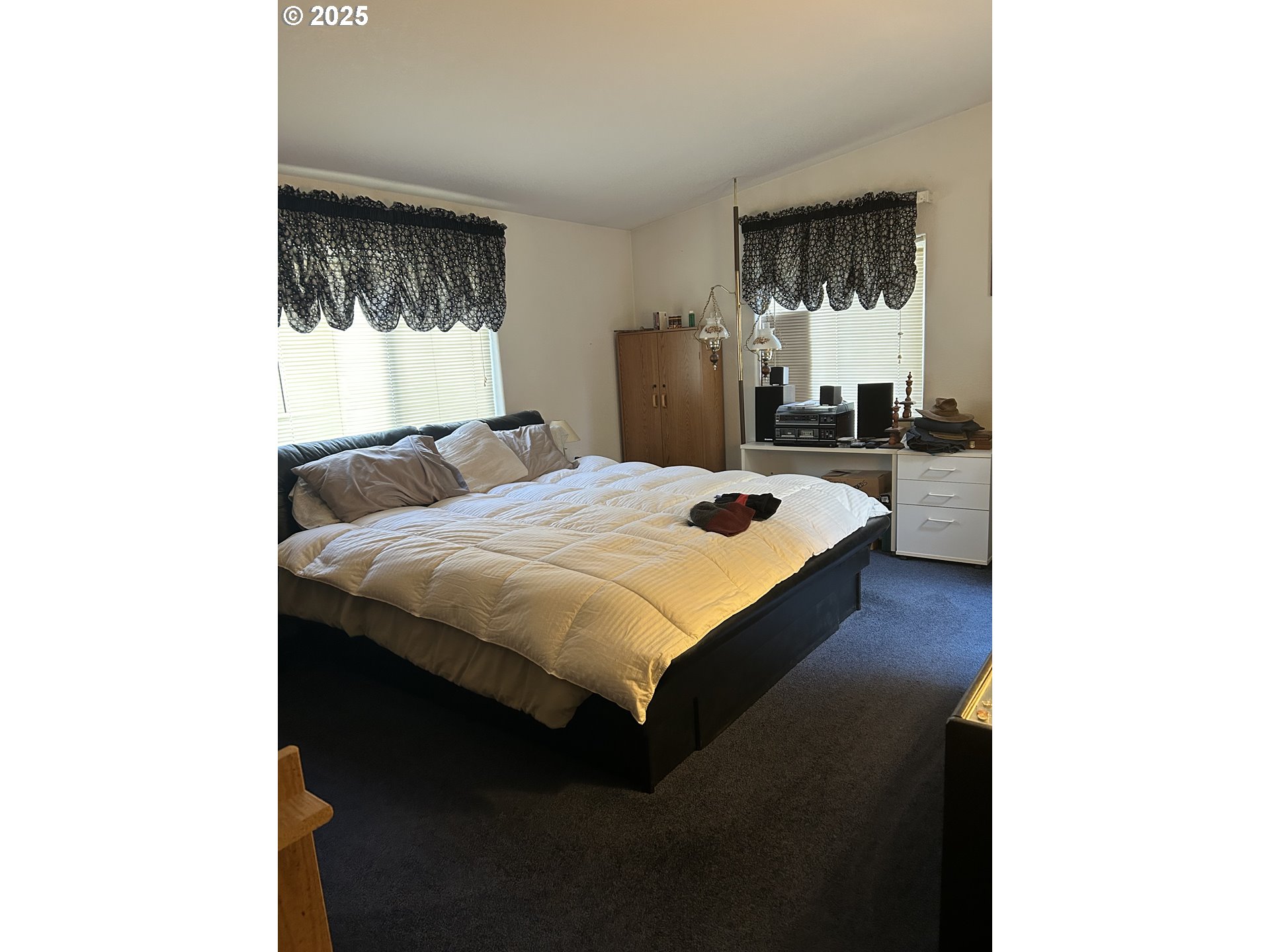 1105 Riverside Drive, Unit 17 Vernonia, OR 97064 - Photo 16 of 26 a bedroom with a bed and a window